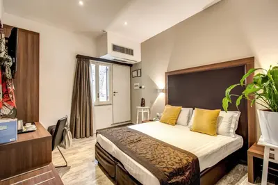 a hotel room with a bed and a window at Rome Garden Hotel in Rome
