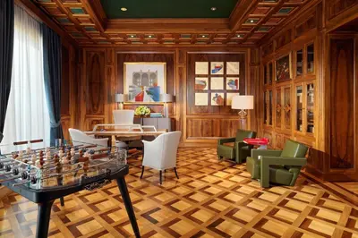a living room with a table and chairs at The Westin Excelsior, Rome in Rome