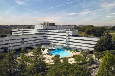 an external view of a building with a pool at Cardo Roma, Autograph Collection in Rome