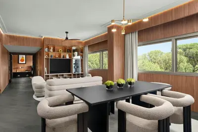 a living room with a table and chairs at Cardo Roma, Autograph Collection in Rome