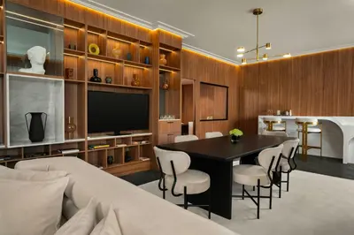 a dining room with a table and chairs and a television at Cardo Roma, Autograph Collection in Rome