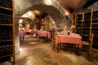 a wine tasting room with tables and bottles of wine at Bettoja Hotel Massimo d'Azeglio in Rome