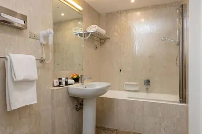 a bathroom with a sink and a shower at Bettoja Hotel Mediterraneo in Rome