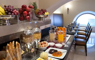 a buffet line with many different types of food at c-hotels Fiume in Rome