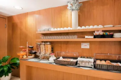 a kitchen with a counter with food on it at Best Western Ars Hotel in Rome