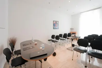 a room with a table and chairs in it at Best Western Ars Hotel in Rome