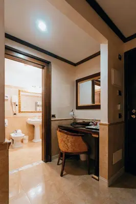 a bathroom with a desk and a sink and a toilet at Hotel Pantheon in Rome