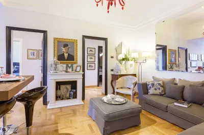 a living room with a couch and a table at Casa Roma Luxury Apartment in Rome