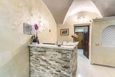 a kitchen with a stone counter in a room at Hotel Family House in Rome