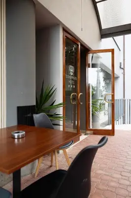 a dining room with a wooden table and chairs at Scheppers Hotel in Rome