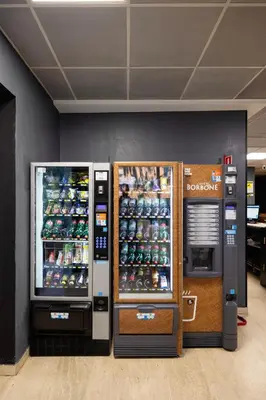 two vending machines are next to each other at Scheppers Hotel in Rome