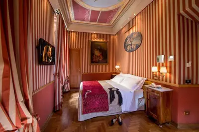 a view of a city with buildings and a clock tower at The Inn at the Spanish Steps Luxury Collection - The Inn at the Spanish Steps in Rome