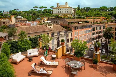 a view of a city from the roof of a building at The Inn at the Spanish Steps Luxury Collection - The Inn at the Spanish Steps in Rome