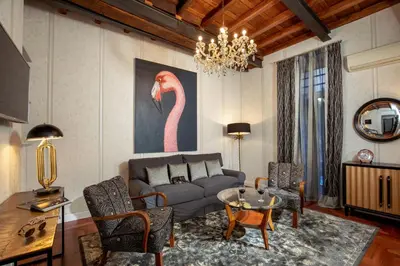 a bedroom with a large bed with pillows on it at The Inn at the Spanish Steps Luxury Collection - The Inn at the Spanish Steps in Rome