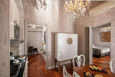 a bedroom with a large bed and a window at The Inn at the Spanish Steps Luxury Collection - The Inn at the Spanish Steps in Rome