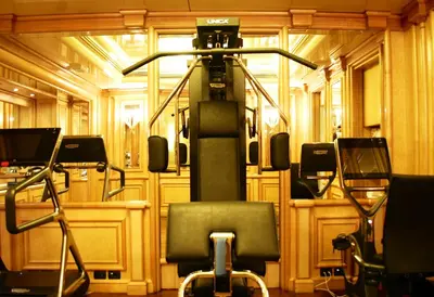 a bedroom with a large bed and a couch at Hotel Valadier in Rome