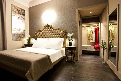 a bedroom with a bed in a room at Hotel Valadier in Rome