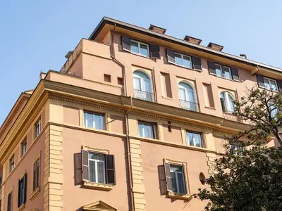 a tall building with windows on top of it at Numa Rome Barberini in Rome