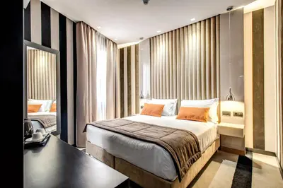 a hotel room with a bed and a window at Doria Palace Boutique Hotel in Rome