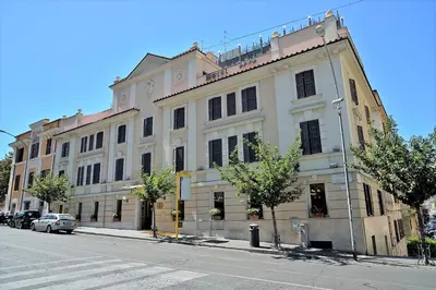 a large white building on the side of a street at Tmark Hotel Vaticano in Rome