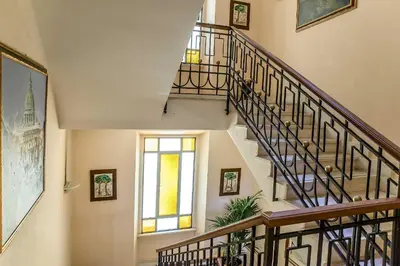a staircase in a house with a window at Tmark Hotel Vaticano in Rome