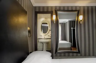 a bathroom with a sink and a mirror at Hotel Royal Court in Rome