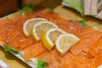 a close up of a fish with lemon slices on it at Best Western Hotel Piccadilly in Rome