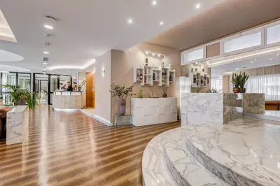 a lobby of a building with a reception counter at Best Western Hotel Piccadilly in Rome