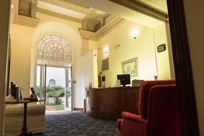an entrance to a courtroom with a desk in a room at Hotel Villa Delle Rose in Rome