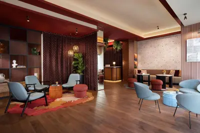 a lobby with chairs and a waiting room at The Spring House Hotel Rome Vatican, Tapestry Collection Hilton in Rome