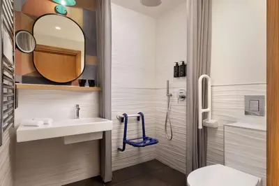 a bathroom with a sink and a shower at The Spring House Hotel Rome Vatican, Tapestry Collection Hilton in Rome