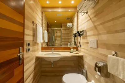 a bathroom with a sink and a mirror at Hotel Tritone in Rome