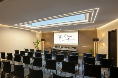 a conference room with a table and chairs at The Major Hotel in Rome