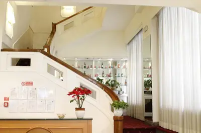 a staircase in a building with a stair case at GH Hotel San Giusto in Rome