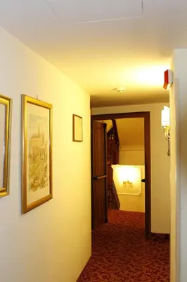 a hallway of a hotel room with a picture on the wall at Hotel Genio in Rome