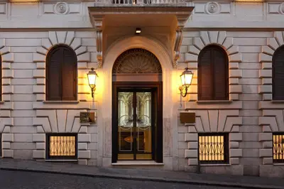 a building with a door with lights on it at Hotel Barberini in Rome