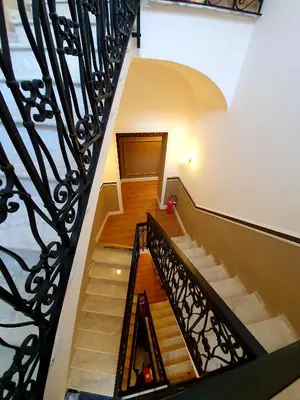 a staircase in a building with a railing at Hotel Coppede' in Rome