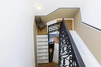 a staircase in a house with white walls at Hotel Coppede' in Rome