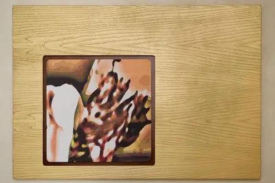 a picture of a painting on a wooden table at Residenza Frattina in Rome