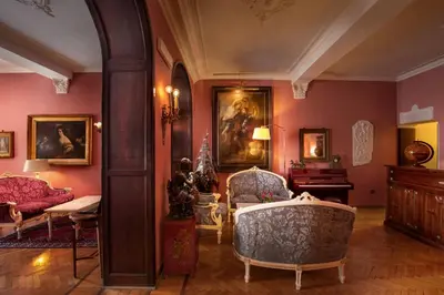 a room with two chairs and a painting on the wall at Residenza Frattina in Rome