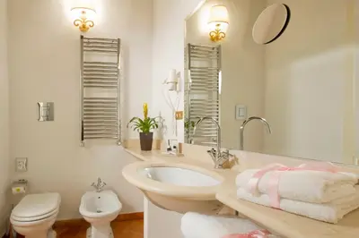 a bathroom with a sink and a toilet at Residenza Frattina in Rome