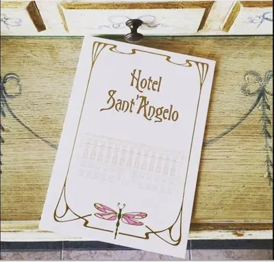 a sign on a table with a calendar at Hotel Sant'Angelo in Rome