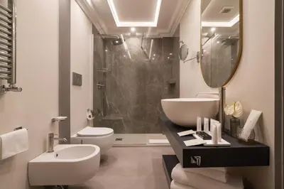 a bathroom with a sink and a toilet and a shower at Antico Albergo del Sole al Pantheon in Rome