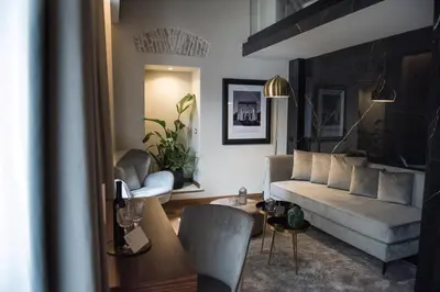 a living room with a couch and a table at Antico Albergo del Sole al Pantheon in Rome