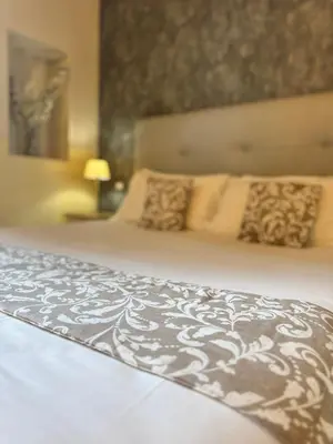 a bedroom with a large bed with pillows at My Monti Place in Rome