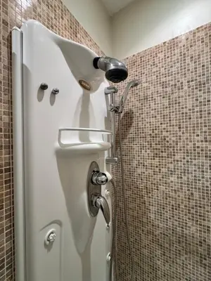 a shower in a bathroom with a toilet in a stall at My Monti Place in Rome