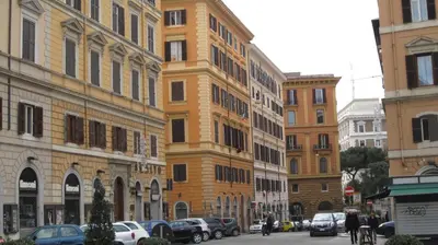 a row of tall buildings on a city street at My Monti Place in Rome