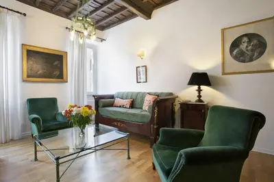 a living room with two chairs and a couch at Colosseo et Esquilino - LOCAPPART in Rome