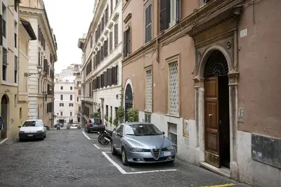 a car parked in a parking lot in an alley at Colosseo et Esquilino - LOCAPPART in Rome