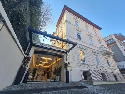a building with a glass door in front of it at Hotel La Ville Rome in Rome